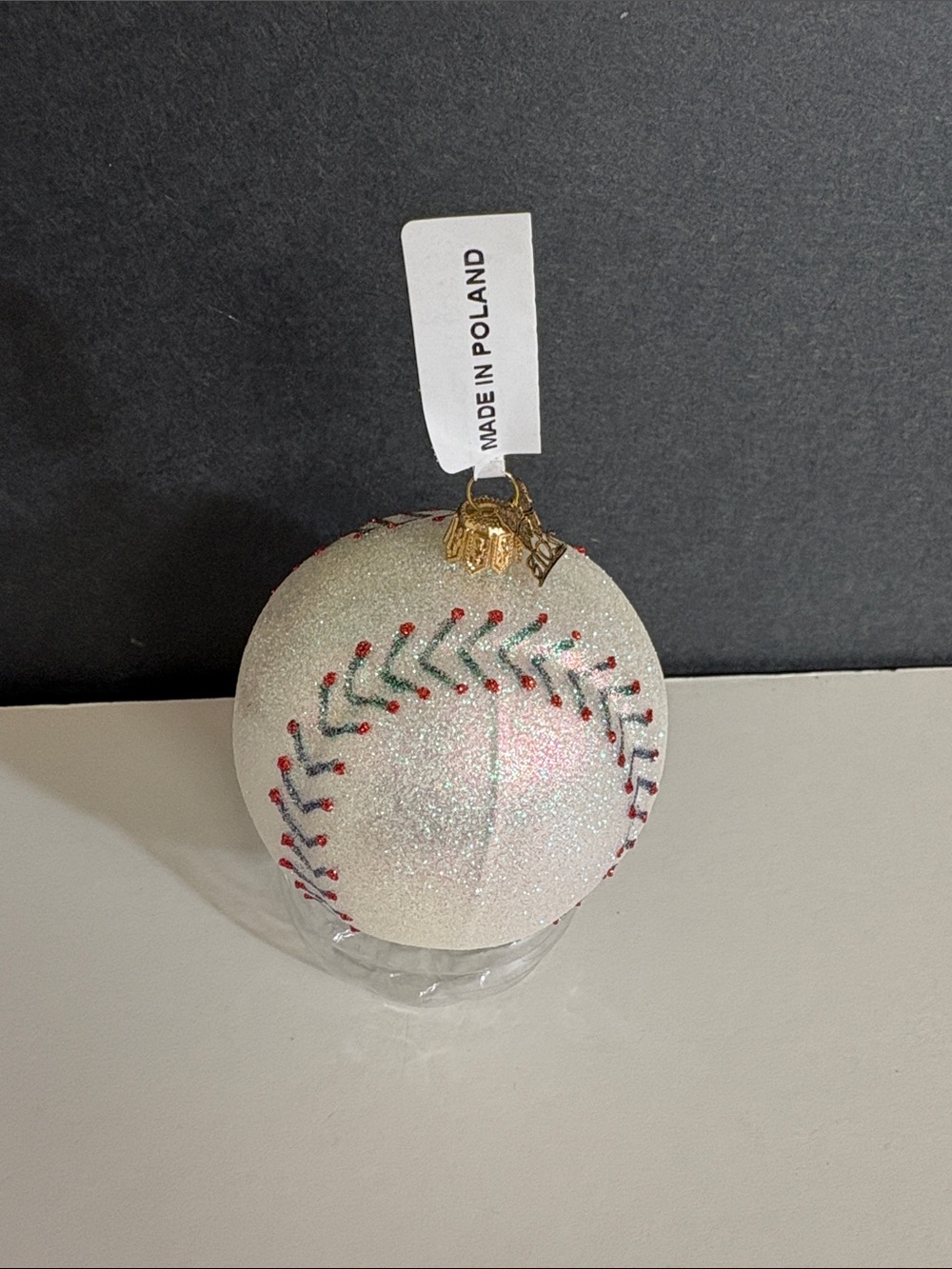 a mouth-blown glass baseball Christmas ornament handcrafted in Poland